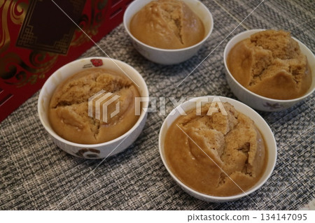 Several bowls of steamed sponge cake Several bowls of steamed sponge cake 134147095