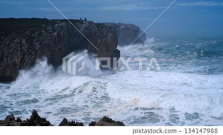 Dramatic view of huge waves crashing against the limestone cliffs at Bufones de Pria, Asturias, Spain 134147988