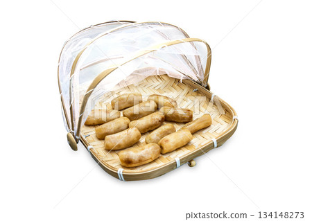 Top view of Dried bananas in Bamboo basket to prevent cattle fly, focus selectiveTop view of Dried bananas in Bamboo basket to prevent cattle fly, focus selective 134148273
