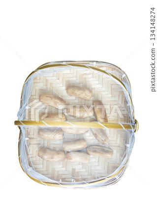 Top view of Dried bananas in Bamboo basket to prevent cattle fly, focus selective Top view of Dried bananas in Bamboo basket to prevent cattle fly, focus selective 134148274