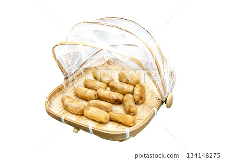 Top view of Dried bananas in Bamboo basket to prevent cattle fly, focus selective Top view of Dried bananas in Bamboo basket to prevent cattle fly, focus selective 134148275