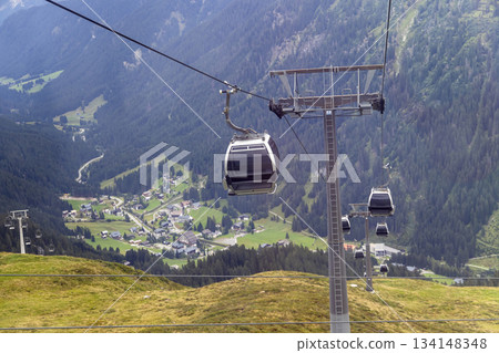 Cable cars transport visitors above Gargellen in Vorarlberg Austria during summer months 134148348
