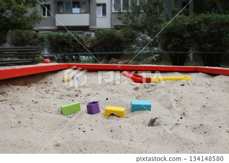 Sandbox with various outdoor toys. Sandbox for children's games. Summer concept. Sandbox with various outdoor toys. Sandbox for children's games. Summer concept. 134148580