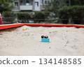 Sandbox with various outdoor toys. Sandbox for children's games. Summer concept. 134148585