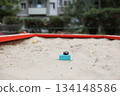 Sandbox with various outdoor toys. Sandbox for children's games. Summer concept. 134148586