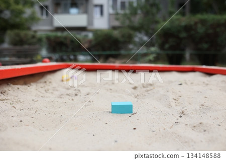 Sandbox with various outdoor toys. Sandbox for children's games. Summer concept. Sandbox with various outdoor toys. Sandbox for children's games. Summer concept. 134148588