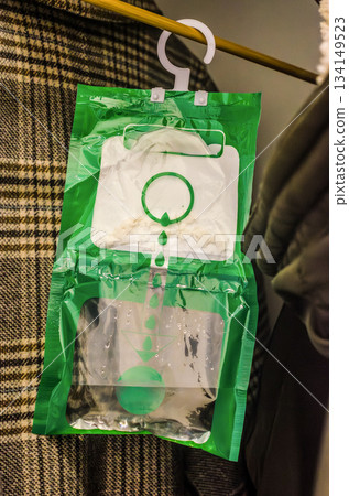 Hanging Moisture Absorber Bag for Closet and Wardrobe 134149523