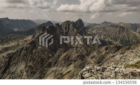 Majestic mountain peaks rising above the clouds in high tatras, slovakia Majestic mountain peaks rising above the clouds in high tatras, slovakia 134150556