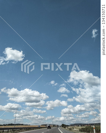 Highway leading to mnisek pod brdy under a cloudy sky in july 2018 Highway leading to mnisek pod brdy under a cloudy sky in july 2018 134150711