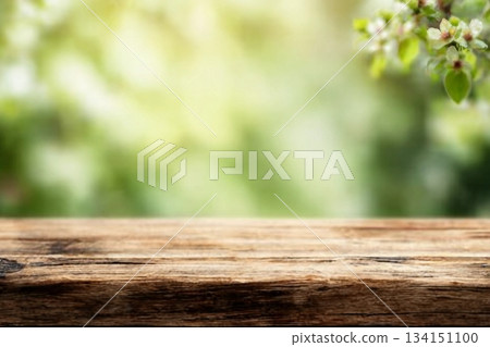 Radiant green spring background panorama with wooden table for a concept Radiant green spring background panorama with wooden table for a concept 134151100