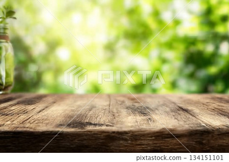 Radiant green spring background panorama with wooden table for a concept Radiant green spring background panorama with wooden table for a concept 134151101