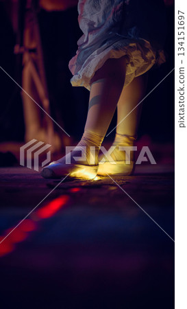 Close-up of pointe shoes placed on illuminated stage mark 134151697
