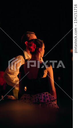 Ballet performers waiting in wings under warm stage illumination. Ballet performers waiting in wings under warm stage illumination. 134151716