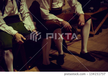 Two ballet dancers in costume sitting backstage before going onstage 134151737