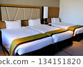 A beautiful hotel room with a triple bed 134151820