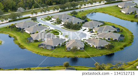 Waterfront single family homes in Florida residential area. Real estate development in American suburbs 134152715
