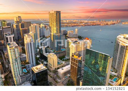 Urban cityscape of Miami Brickell downtown district in Florida, USA at sunset. Skyline with waterfront skyscraper buildings in modern American city Urban cityscape of Miami Brickell downtown district in Florida, USA at sunset. Skyline with waterfront skyscraper buildings in modern American city 134152821
