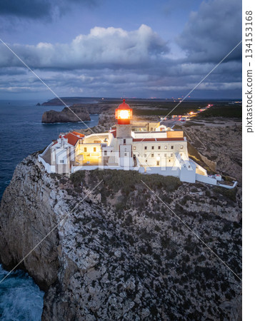 Cape Saint Vincent, Lighthouse and Atlantic Ocean in Evening Twilight. Aerial View. Algarve Cape Saint Vincent, Lighthouse and Atlantic Ocean in Evening Twilight. Aerial View. Algarve 134153168