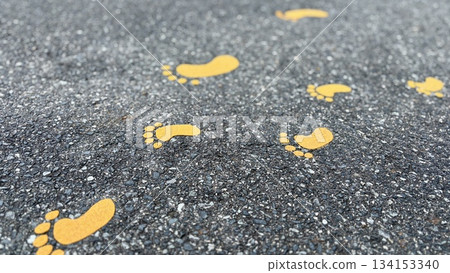 Yellow footprints painted on the road Yellow footprints painted on the road 134153340