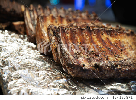 Fried ribs lie on foil Fried ribs lie on foil 134153871