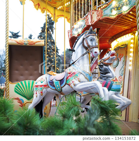 Children's carousel with white horses Children's carousel with white horses 134153872