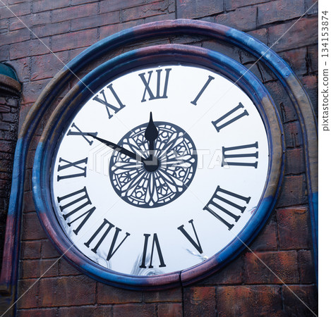 Big dark brick tower clock Big dark brick tower clock 134153874