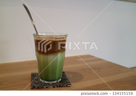 Matcha iced latte on the wooden table 134155159