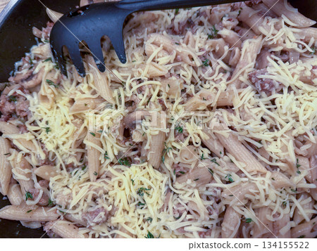 Creamy tuna pasta, Hearty pasta dish topped with cheese and herbs 134155522