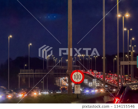 Traffic jam lights, Evening congestion with vehicle queues Traffic jam lights, Evening congestion with vehicle queues 134155546