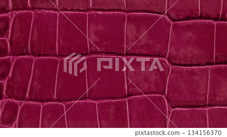 Close-up of luxurious lava red crocodile leather texture with bold rectangular embossing and glossy finish. Natural background for fashion design, material texture, color trend backdrop Close-up of luxurious lava red crocodile leather texture with bold rectangular embossing and glossy finish. Natural background for fashion design, material texture, color trend backdrop 134156370