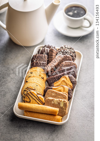 Christmas sweet and cookies on plate on kitchen table. Christmas sweet and cookies on plate on kitchen table. 134156493