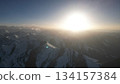 Majestic mountain landscape with sunrise illuminating snowy peaks 134157384