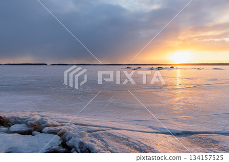 A tranquil winter scene of a frozen lake at sunset. Vyborg, Russia 134157525