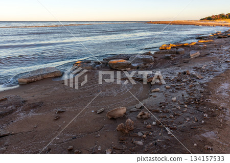 Landscape photography featuring ice floes mixed with sand laying on the coast Landscape photography featuring ice floes mixed with sand laying on the coast 134157533