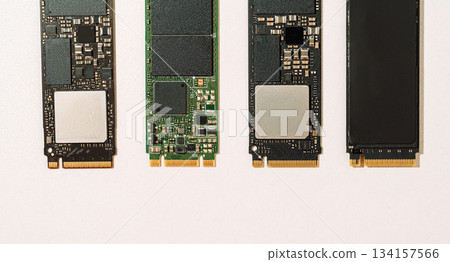 Four M.2 SSD boards top view with copy space on white background Four M.2 SSD boards top view with copy space on white background 134157566