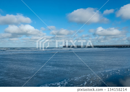 Nieuwpoort, West-Vlaanderen, Belgium, Ocotber 25th, 2025, bright blue sea with distant lighthouse Nieuwpoort, West-Vlaanderen, Belgium, Ocotber 25th, 2025, bright blue sea with distant lighthouse 134158214