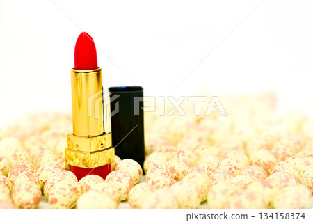 Make up.Red pink cosmetic lipstick on spoted pebbles stones Make up.Red pink cosmetic lipstick on spoted pebbles stones 134158374
