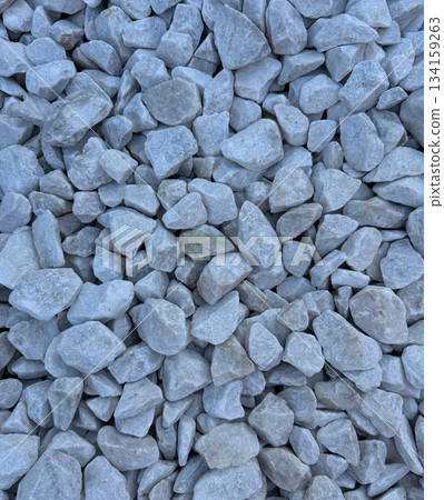 Pattern of white gravel with a uniform, clean texture. lose-up view of small, smooth gravel stones arranged in a seamless, repeating design. Ideal for backgrounds, surfaces, and abstract designs. Pattern of white gravel with a uniform, clean texture. lose-up view of small, smooth gravel stones arranged in a seamless, repeating design. Ideal for backgrounds, surfaces, and abstract designs. 134159263