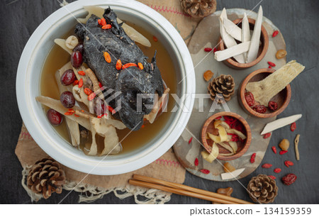 Widely celebrated in Chinese and Asian culinary traditions, the nourishing health stew pictured is known as "Black Chicken Soup" or "silkie chicken soup". Widely celebrated in Chinese and Asian culinary traditions, the nourishing health stew pictured is known as "Black Chicken Soup" or "silkie chicken soup". 134159359