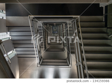 Looking down into the Square shaped Spiral staircase inside of Centre for Contemporary art. 134159366