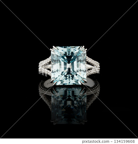 Beautiful white gold ring with diamonds and aquamarine on a black background 134159608