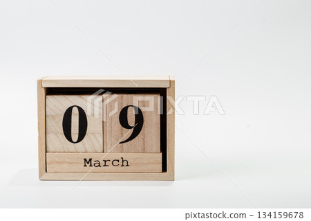 Wooden calendar March 09 on a white background Wooden calendar March 09 on a white background 134159678