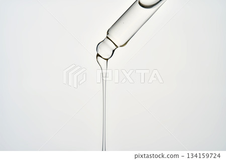 Cosmetic pipette dispensing serum or facial oil 134159724