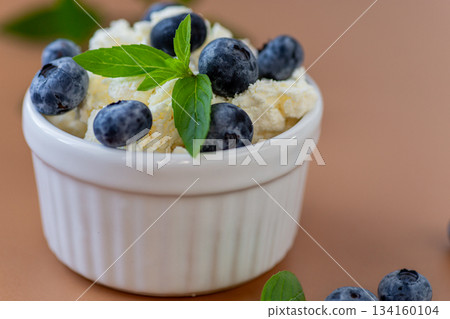 Healthy breakfast cottage cheese with blueberries and fresh mint Healthy breakfast cottage cheese with blueberries and fresh mint 134160104
