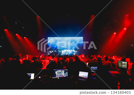Concert crowd under red stage lights 134160403