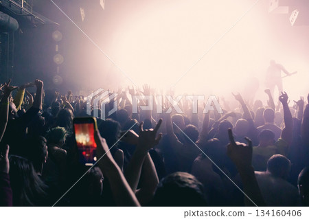 Bright stage lights and cheering crowd 134160406