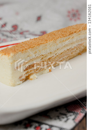 A serving of Napoleon cake or Medovik with honeycomb 134162081