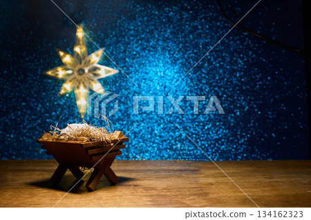 Jesus born. Nativity Scene. A wooden manger with straw under a star 134162323