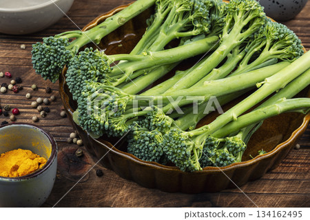 Raw Broccolini on Plate with Herbs and Spices. 134162495