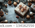 Blue background with Christmas frame of pine needles, gifts and pine cones with copy space 134162550